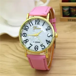 Detail of pink leather strap and gold watch case with a white numeric dial face