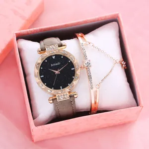 Detalle del reloj con esfera estrellada y pulsera de cristal en caja de regalo