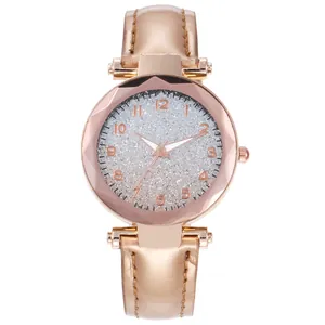 Elegant rose gold women's watch with silver glitter dial and bronze faux leather strap