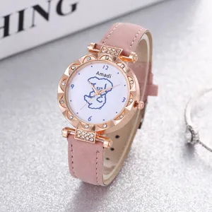 Detail of rose gold watch featuring diamond-set bezel and a cute puppy dial design