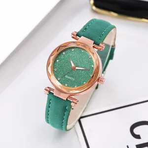 Detail of rose gold case with green frosted dial and rhinestone markers for ladies