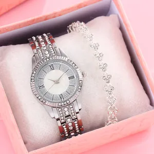 Elegant women's silver watch set with rhinestones and heart bracelet in a pink gift box