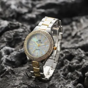 Elegante orologio da donna al quarzo con strass e quadrante in madreperla su roccia
