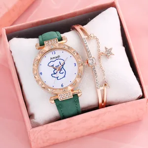 Close-up of rose gold watch with star charm bracelet set in a pink gift box