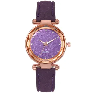 Detail of purple starlight dial with rhinestone markers and rose gold textured bezel