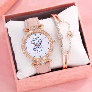 Detailed macro view of elegant pink leather watch and star charm bracelet in gift box