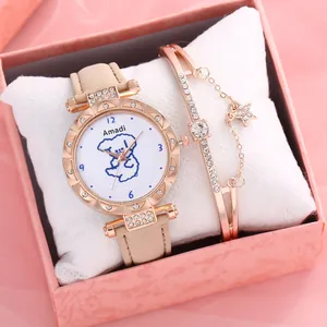 Detail of rose gold quartz watch with cute puppy dial and matching star pendant bracelet
