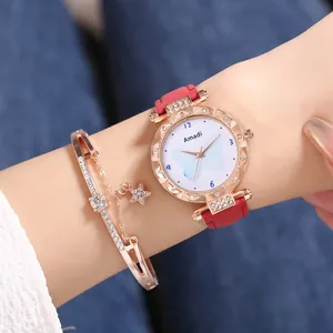 Montre à quartz or rose pour femme avec cadran papillon bleu et bracelet étoile