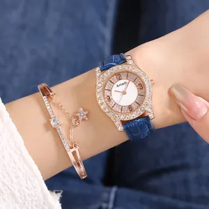 Orologio da donna al quarzo oro rosa con cinturino in pelle blu e bracciale con stella