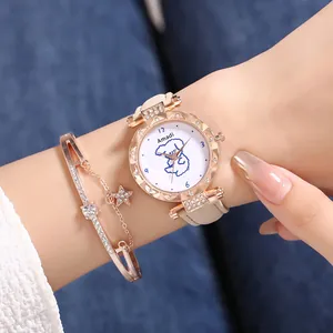 Close-up of rose gold watch with rhinestone bezel and matching star charm bracelet