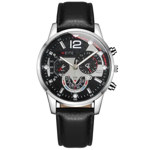 Detailed close-up of a silver stainless steel men's watch with black leather strap