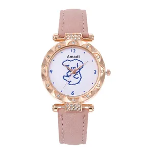 Detailed close-up of pink leather watch strap with rose gold rhinestone case and dog dial