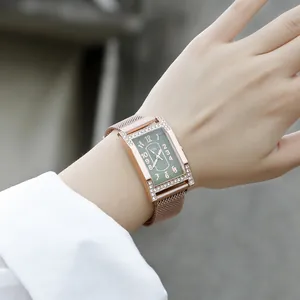 Elegant rose gold rectangular watch with green dial and rhinestones on mesh strap