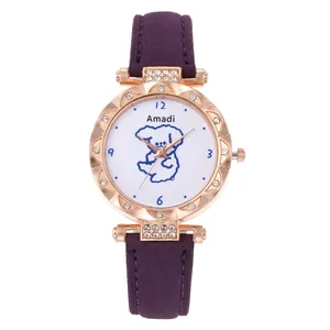 Macro shot of rose gold watch case with rhinestone bezel and purple matte strap