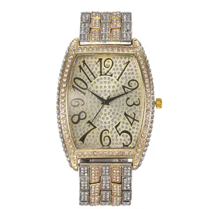 Luxurious tonneau quartz watch with iced-out diamond bezel and two-tone steel band