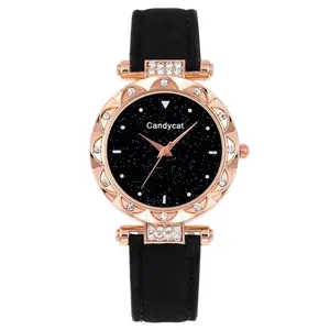 Detailed macro of rose gold bezel with rhinestones and black starry sky dial design