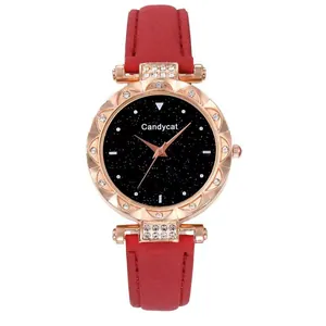 Detailed close-up of the black starry sky dial and rose gold bezel on a women's leather watch