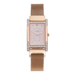 Detail of rose gold rectangular watch with rhinestone edges and milanese mesh strap