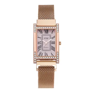 Close-up of rectangular H-shaped rose gold case with crystals and Roman numeral dial