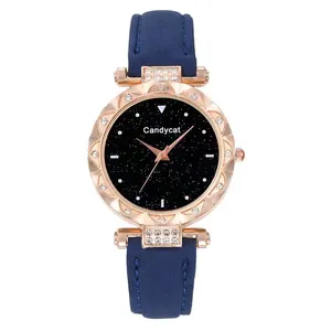 Detail of starry dial quartz watch with navy leather strap and crystal bezel