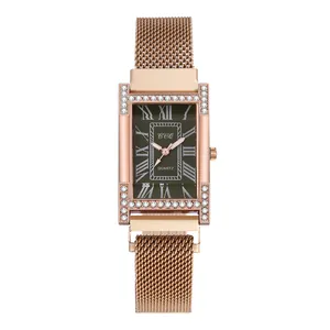 Detail of rose gold H-shaped watch case with crystals and brown Roman numeral dial