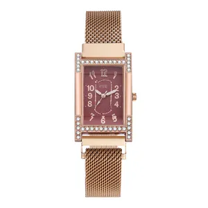 Close-up of elegant rose gold rectangular quartz watch with crystal-encrusted case detail