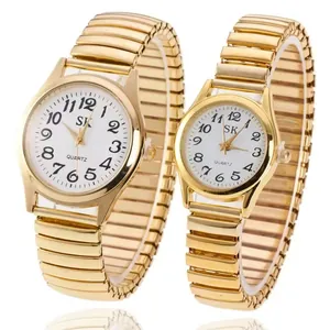 Montres à quartz dorées pour couples avec cadran blanc et bracelet extensible en métal