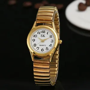 Montre à quartz dorée classique avec bracelet extensible et cadran blanc pour femmes