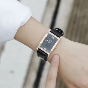 Women's quartz watch with rectangular rose gold rhinestone case and black leather strap