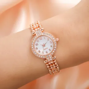 Elegant rose gold women's watch with double rhinestone bezel and quartz movement