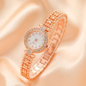 Elegant rose gold ladies quartz watch with rhinestone bezel and beaded link bracelet
