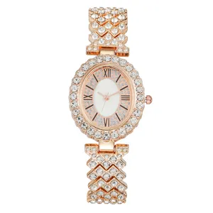 Elegant rose gold women's watch with rhinestone X-link band and Roman numeral dial