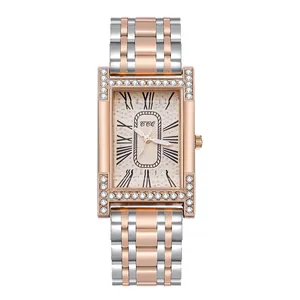 Detailed macro of rectangular rose gold watch with rhinestone bezel and Roman numerals