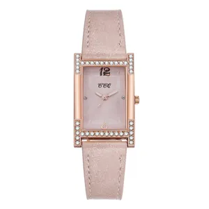 Macro detail of rectangle rose gold watch case featuring crystal pavé setting and pink dial