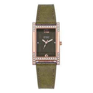 Close-up of olive green dial with rose gold case and rhinestones on square watch
