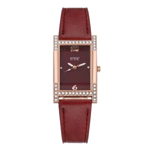 Close-up of wine red square dial with rose gold diamond bezel and leather strap watch