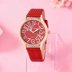 Montre quartz rouge en cuir pour femme avec lunette sertie de diamants et cadran doré et chiffres