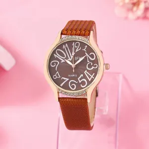 Montre quartz femme avec lunette en strass or rose et bracelet en cuir marron chic