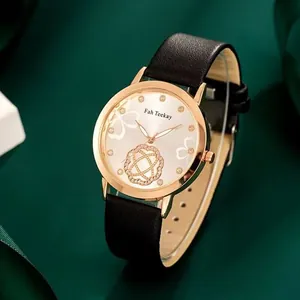 Macro view of rose gold women's watch with four-leaf clover dial on green satin