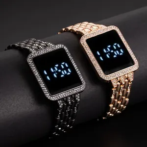 Detail of square LED touch watches with diamond bezel in silver and rose gold finishes