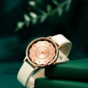 Montre femme à quartz avec boîtier or rose, cadran noir soleil et bracelet en cuir blanc