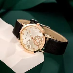 Elegant women watch with floral pattern dial and black leather strap on white pedestal
