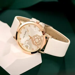 Women's fashion quartz watch with rose gold clover dial and white leather strap