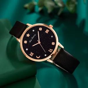 Elegante reloj de mujer en oro rosa con esfera de cielo estrellado y correa negra
