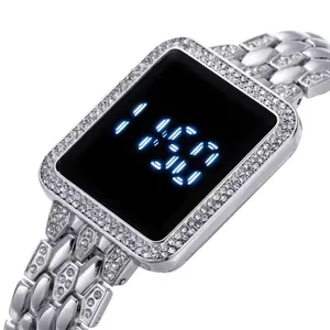 Close-up of a silver rectangular LED watch with crystal diamond bezel and metal link strap
