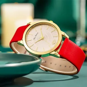 Montre à quartz pour femme avec bracelet en cuir rouge et cadran doré à effet soleil