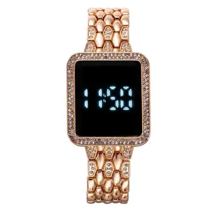 Close-up of rose gold square LED watch with sparkling rhinestones and scale band