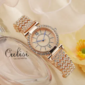 Women's rose gold quartz watch with rhinestones, champagne dial and blue hands