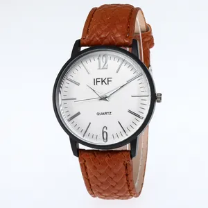 Macro shot of business quartz watch with brown woven leather strap and white striped dial