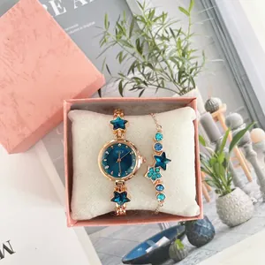 Elegant rose gold star watch and bracelet set in a pink gift box with navy starry dial
